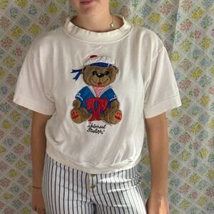 VINTAGE 80S SHORT SLEEVE WHITE UNIVERSAL STUDIOS BEAR SHIRT SIZE SMALL